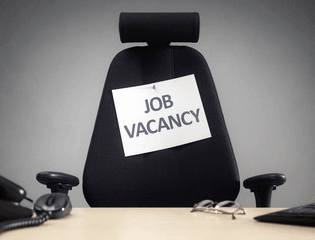 Chair with a job vacancy sign