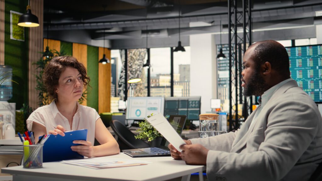 human resources recruiter evaluating a confident male candidate