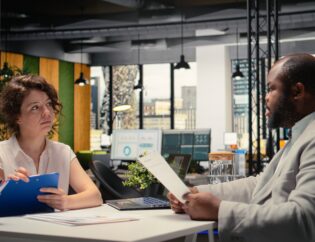human resources recruiter evaluating a confident male candidate