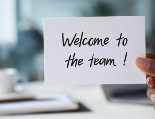human resources department welcoming new employee to corporate team, offering warm greeting card, celebrating successful hiring and onboarding process in office workplace