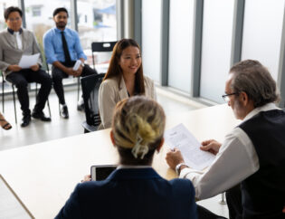human resources : company, successful deal. human resources manager interviewing applicant at modern office. asian woman candidate job interviewing and answering question hr cv recruiter